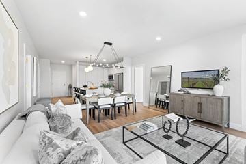 Westbury apartment for rent - A modern living room with a grey sofa and a glass coffee table.