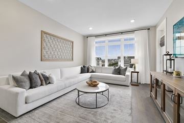 Westbury apartment for rent - A modern living room with a white sofa and a coffee table.