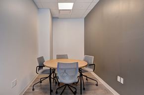 Waterloo apartment for rent - A conference room with a round table and four chairs.
