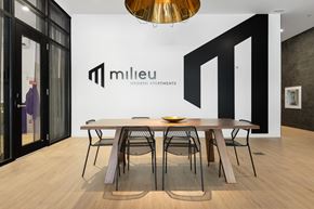 Ottawa apartment for rent - A modern dining room with a wooden table and chairs.