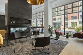 Ottawa apartment for rent - A modern living room with a fireplace and comfortable seating.