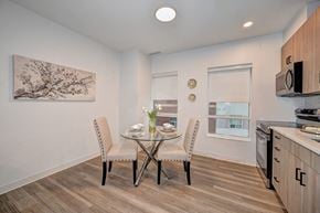 Waterloo apartment for rent - A dining room with a table set for two and a painting on the wall.