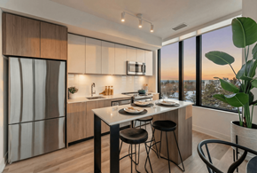 Hamilton apartment for rent - A modern kitchen with a dining table set for two.