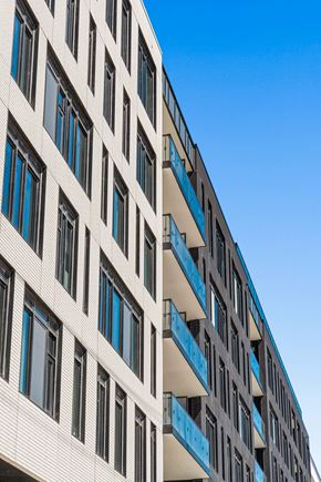 Hamilton apartment for rent - A tall building with balconies and windows.