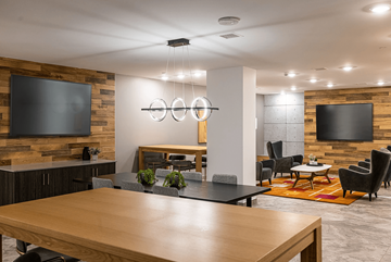 Edmonton apartment for rent - A modern living room with a wooden table and chairs.