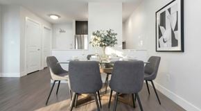 Calgary apartment for rent - A modern dining room with a table set for four.