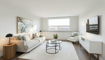 Calgary apartment for rent - A living room with a white couch, a black table, and a painting on the wall.