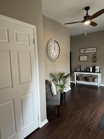 Dayton apartment for rent - a living room with a chair and a clock on the wall