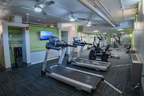 Dayton apartment for rent - A gym with treadmills, elliptical machines, and other exercise equipment.