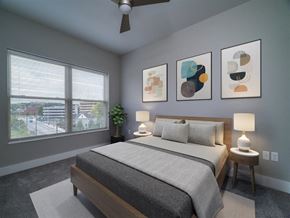 Dayton apartment for rent - a bedroom with a bed and a large window