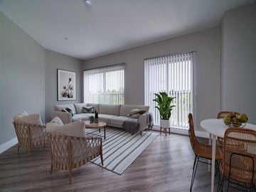 Dayton apartment for rent - a living room with a couch and a table and chairs