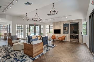 Miami apartment for rent - A spacious living room with a large wooden coffee table and multiple seating options.