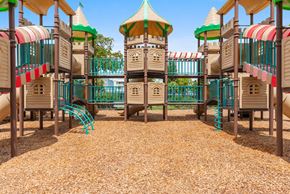 Lauderhill apartment for rent - A playground with a wooden structure and a slide.