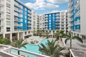 Miami apartment for rent - Heated zero-edge saltwater pool with sundeck, cabanas, fire pits and water feature