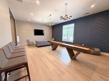 Concord apartment for rent - A room with wooden floors and a long wooden table.