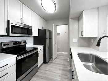 Fully-equipped kitchens with built-in microwaves and breakfast bars