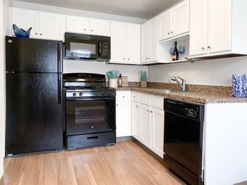 Fully-equipped kitchens with gas or electric ranges and built-in microwaves