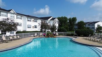 Heated outdoor pool with cascading waterfall