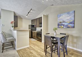 Painesville apartment for rent - Kitchen with hardwood-inspired flooring and vaulted ceilings in select suites