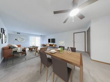 Parma Heights apartment for rent - A modern living room with a dining table and chairs.