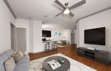 Cornelius apartment for rent - A living room with a grey couch and a black television.