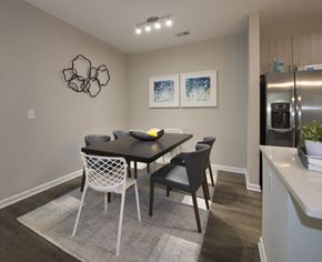 Charlotte apartment for rent - Dining room with overhead lighting and hardwood-inspired flooring