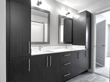 Dual vanities and framed mirrors in bathrooms