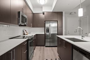 Rochester Hills apartment for rent - Fully-equipped kitchens with electric top ranges, double-sided refrigerators, built-in microwaves and dishwashers