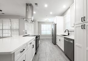 Charlotte apartment for rent - Newly renovated suites include quartz countertops, stainless steel appliances and matte black finishes and hardware (Legacy)