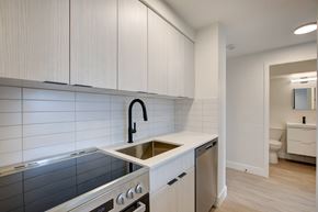 Denver apartment for rent - Modern kitchen with stainless steel appliances at Belle on the Park Apartments, Colorado