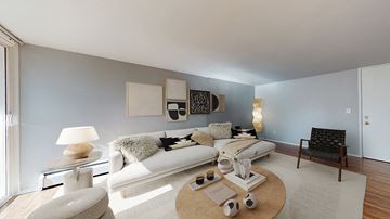 Aurora apartment for rent - A living room with a white couch and a coffee table.