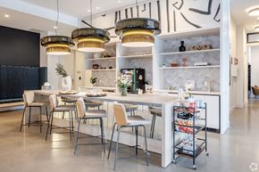 Denver apartment for rent - A modern kitchen with a dining table and chairs.