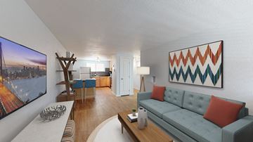 Denver apartment for rent - A living room with a couch, a coffee table, and a large painting on the wall.