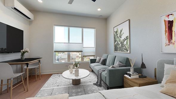 Denver apartment for rent - A modern living room with a flat screen TV and a large window.