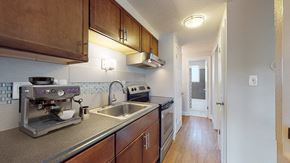 Denver apartment for rent - A kitchen with a coffee maker and a sink.