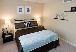 Denver apartment for rent - A bedroom with a large bed and two nightstands.
