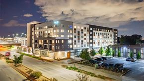 Lakewood apartment for rent - Building Exterior In Night at Railside at Wadsworth Station, Colorado