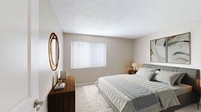 Leadville apartment for rent - A bedroom with a bed, nightstand, and a mirror.