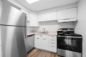 Lakewood apartment for rent - A modern kitchen with a stainless steel refrigerator and oven.
