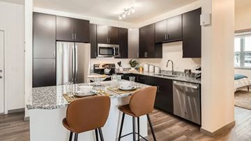 Broomfield apartment for rent - A modern kitchen with a table set for two.