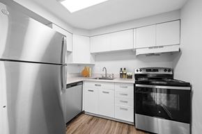 Lakewood apartment for rent - A modern kitchen with a stainless steel refrigerator and stove.