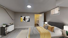 Denver apartment for rent - A bedroom with a bed, nightstand, and a painting on the wall.