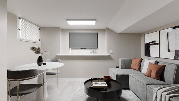 Denver apartment for rent - A modern living room with a grey sofa and a black coffee table.