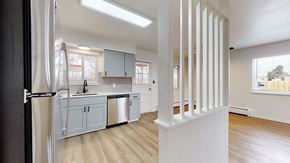 Lakewood apartment for rent - A kitchen with a refrigerator, sink, and cabinets.