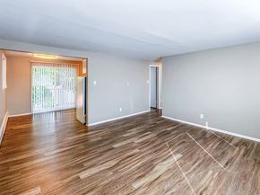 Lakewood apartment for rent - A room with wooden flooring and white walls.