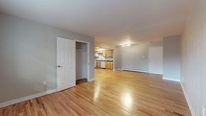 Arvada apartment for rent - A room with wooden floors and white walls.