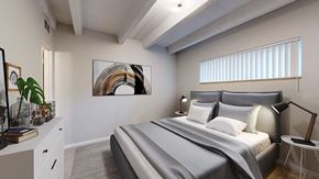 Golden apartment for rent - A bedroom with a large bed and a painting on the wall.