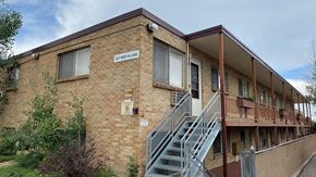 Wheat Ridge apartment for rent - A brick building with a sign that says