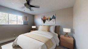 Wheat Ridge apartment for rent - A bedroom with a bed, nightstand, and a ceiling fan.