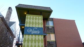Denver apartment for rent - A building with a sign that says "The Vines".